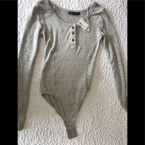 Long sleeved body suit